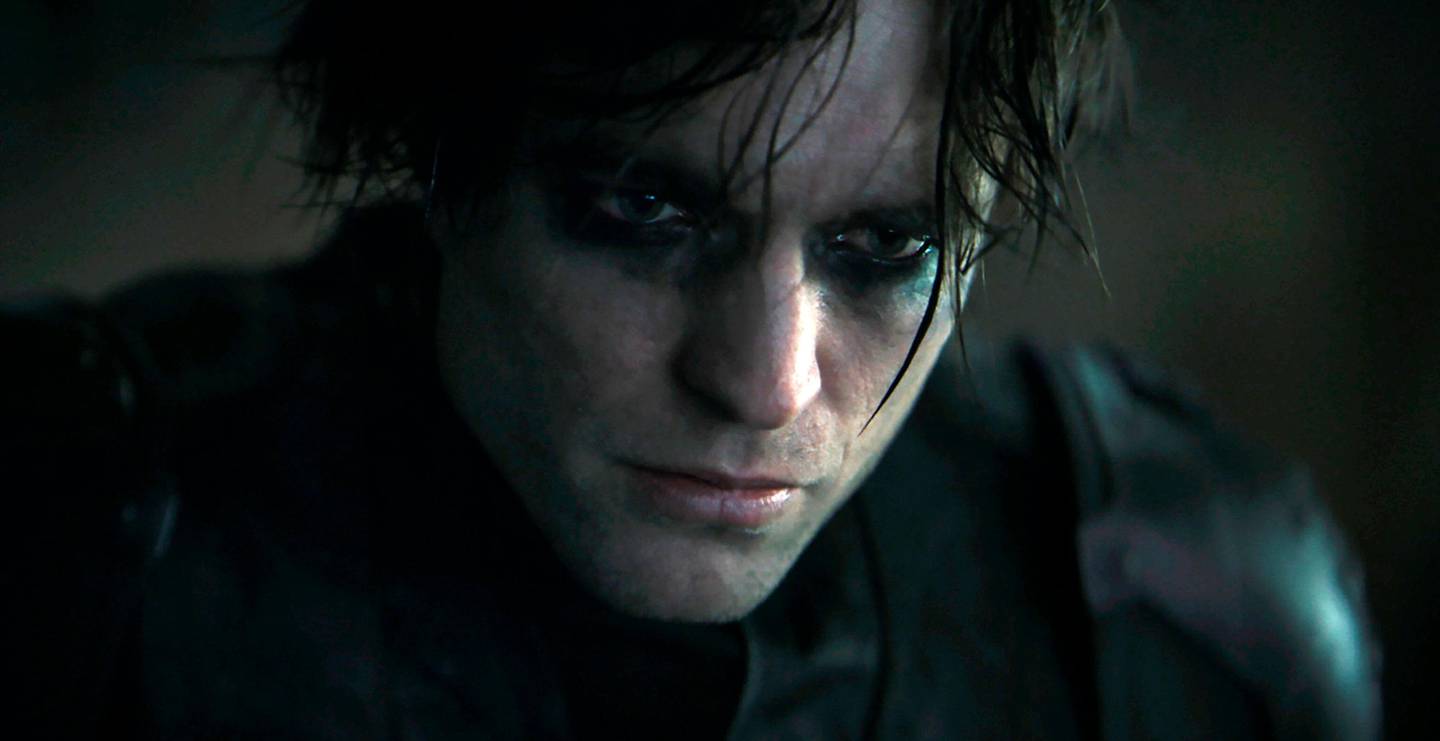 This image released by Warner Bros. Entertainment shows Robert Pattinson as Batman in "The Batman."  Warner Bros. said late Monday that its sci-fi pic Dune will now open in October 2021, instead of this December. The studio also pushed back its Matrix sequel by 8 months to late 2021 and The Batman to 2022. (Warner Bros. Entertainment via AP)