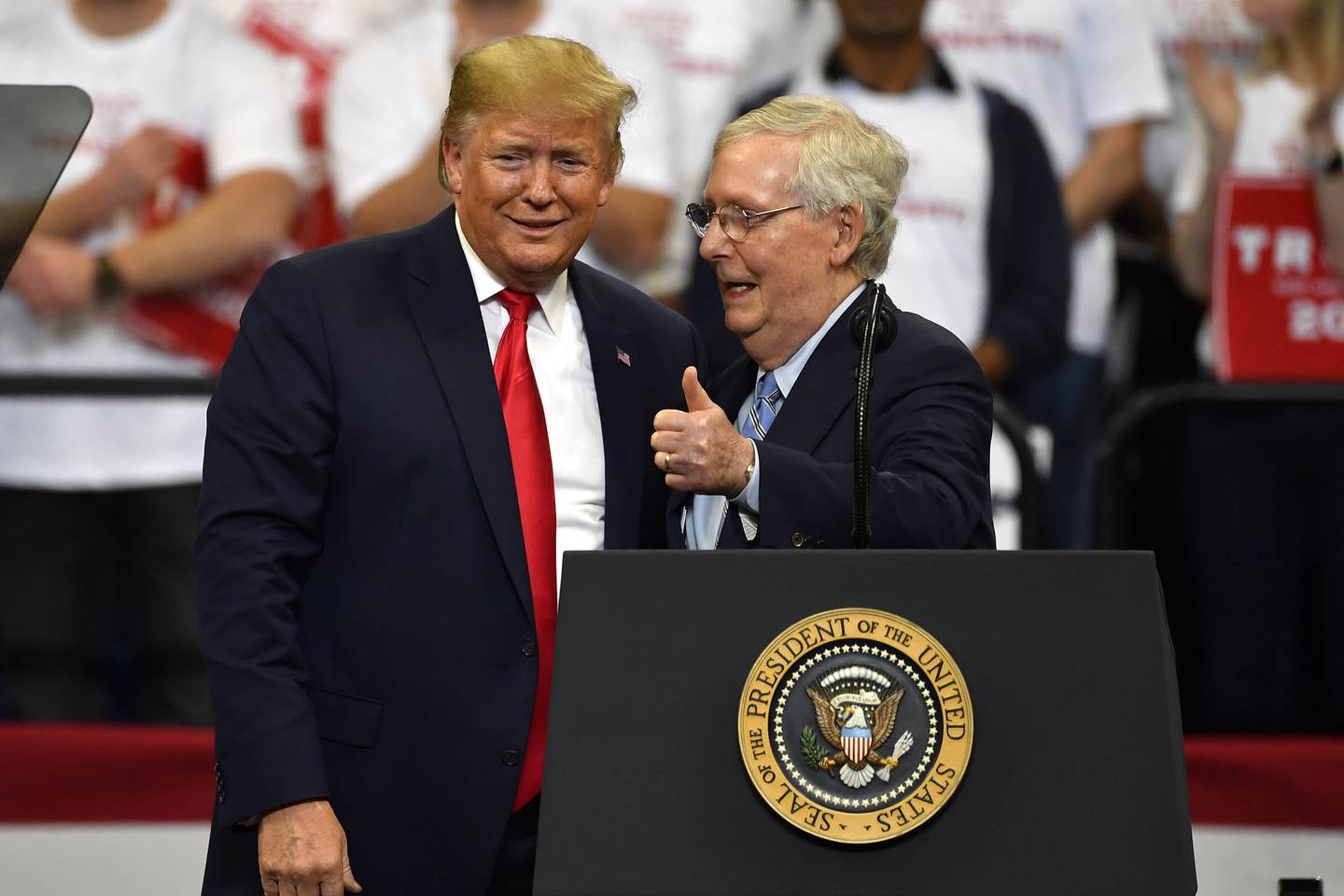 FILE - President Donald Trump, left, and Senate Majority Leader Mitch McConnell of Ky., greet each other during a campaign rally in Lexington, Ky., Nov. 4, 2019. McConnell is the highest ranking Republican in Congress who has yet to endorse Donald Trump's bid to return to the White House. But that's potentially about to change. McConnell's political team and Trump's campaign have been in talks over a possible endorsement and a strategy to unite Republicans on the party's ticket for the November election. (AP Photo/Timothy D. Easley, File)