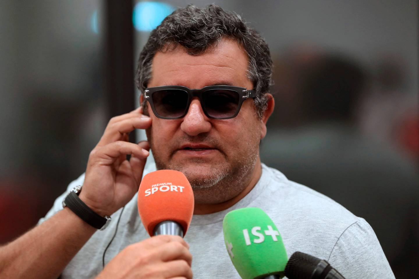 (FILES) In this file photo taken on September 2, 2016, Italian-born Dutch football agent Mino Raiola speaks to journalists during a presentation of Nice's football club new signings at the Allianz Riviera stadium in Nice, southeastern France.
Manchester City were offered the chance to sign Manchester United's Paul Pogba during the January transfer window, according to City manager Pep Guardiola. "I said no. We don't have the money to buy Pogba because he is so expensive," Guardiola told reporters on Friday as he attacked the conduct of agent Mino Raiola.
 / AFP PHOTO / VALERY HACHE