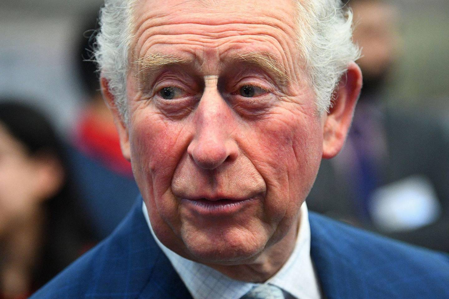 (FILES) In this file photo taken on March 04, 2020 Britain's Prince Charles, Prince of Wales reacts during his visit to the London Transport Museum in London on March 4, 2020, to take part in celebrations to mark 20 years of the museum. - Prince Charles, the eldest son and heir to Queen Elizabeth II, has tested positive for the new coronavirus, his office said on March 25, 2020. The 71-year-old is displaying mild symptoms of COVID-19 "but otherwise remains in good health", Clarence House said in a statement. (Photo by Victoria Jones / POOL / AFP)