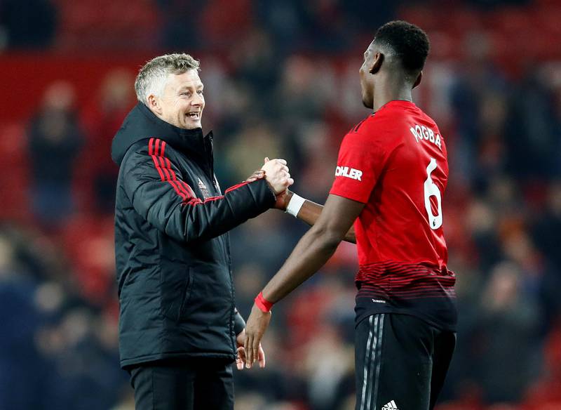 Soccer Football - Premier League - Manchester United v Huddersfield Town - Old Trafford, Manchester, Britain - December 26, 2018  Manchester United's Paul Pogba and interim manager Ole Gunnar Solskjaer after the match       Action Images via Reuters/Jason Cairnduff  EDITORIAL USE ONLY. No use with unauthorized audio, video, data, fixture lists, club/league logos or "live" services. Online in-match use limited to 75 images, no video emulation. No use in betting, games or single club/league/player publications.  Please contact your account representative for further details.