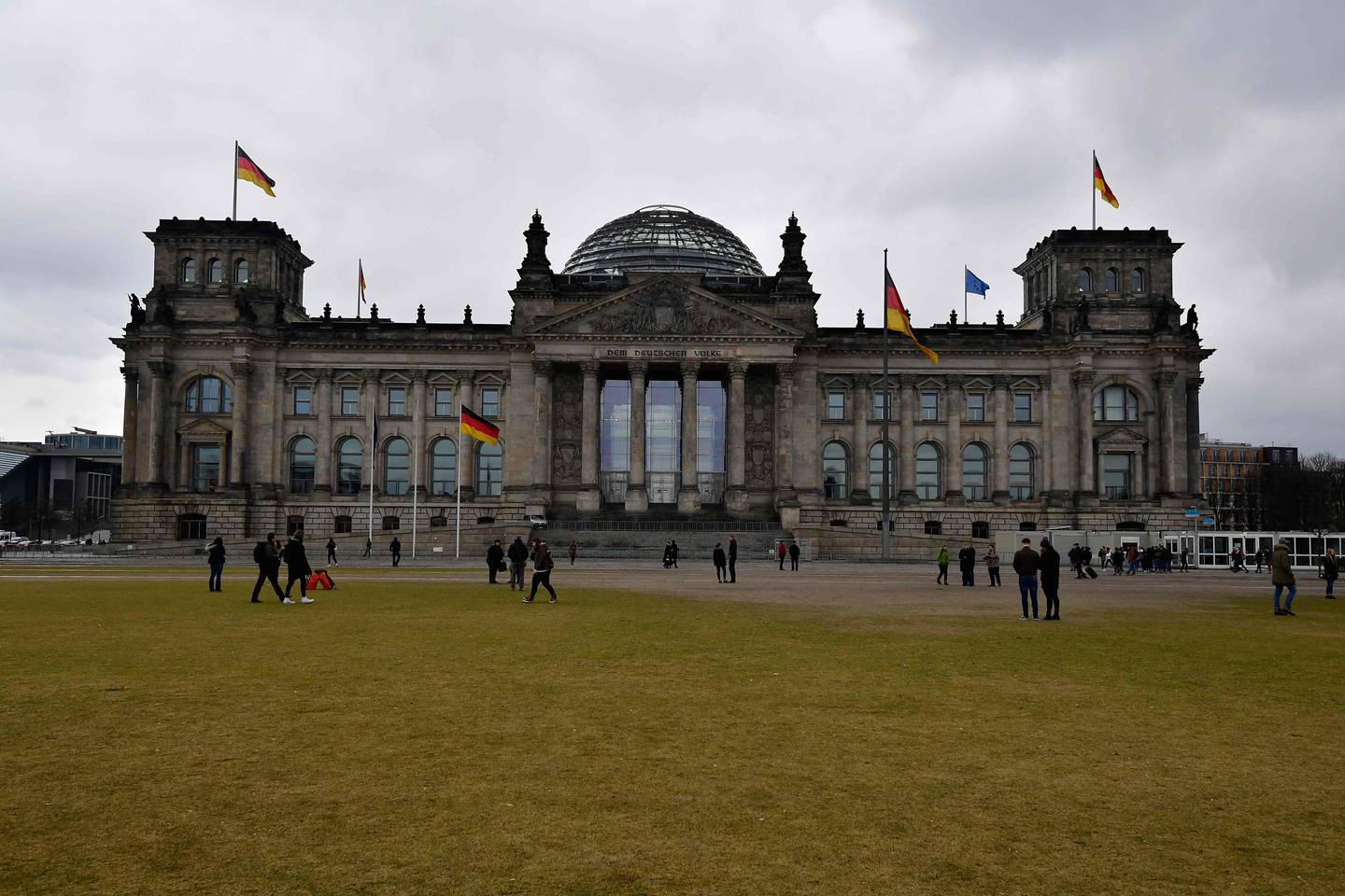 The Reichstag housing the Bundestag (lower house of parliament) is pictured on March 14, 2018 in Berlin, as the new German government was sworn in here.
German Chancellor Angela Merkel, bruised by half a year of post-election coalition haggling, was narrowly confirmed by parliament to her fourth and likely final term at the helm of Europe's biggest economy. Lawmakers in Berlin's glass-domed Reichstag voted 364-315 with nine abstentions for Merkel, who was then formally appointed by President Frank-Walter Steinmeier before taking the oath of office. / AFP PHOTO / Tobias SCHWARZ