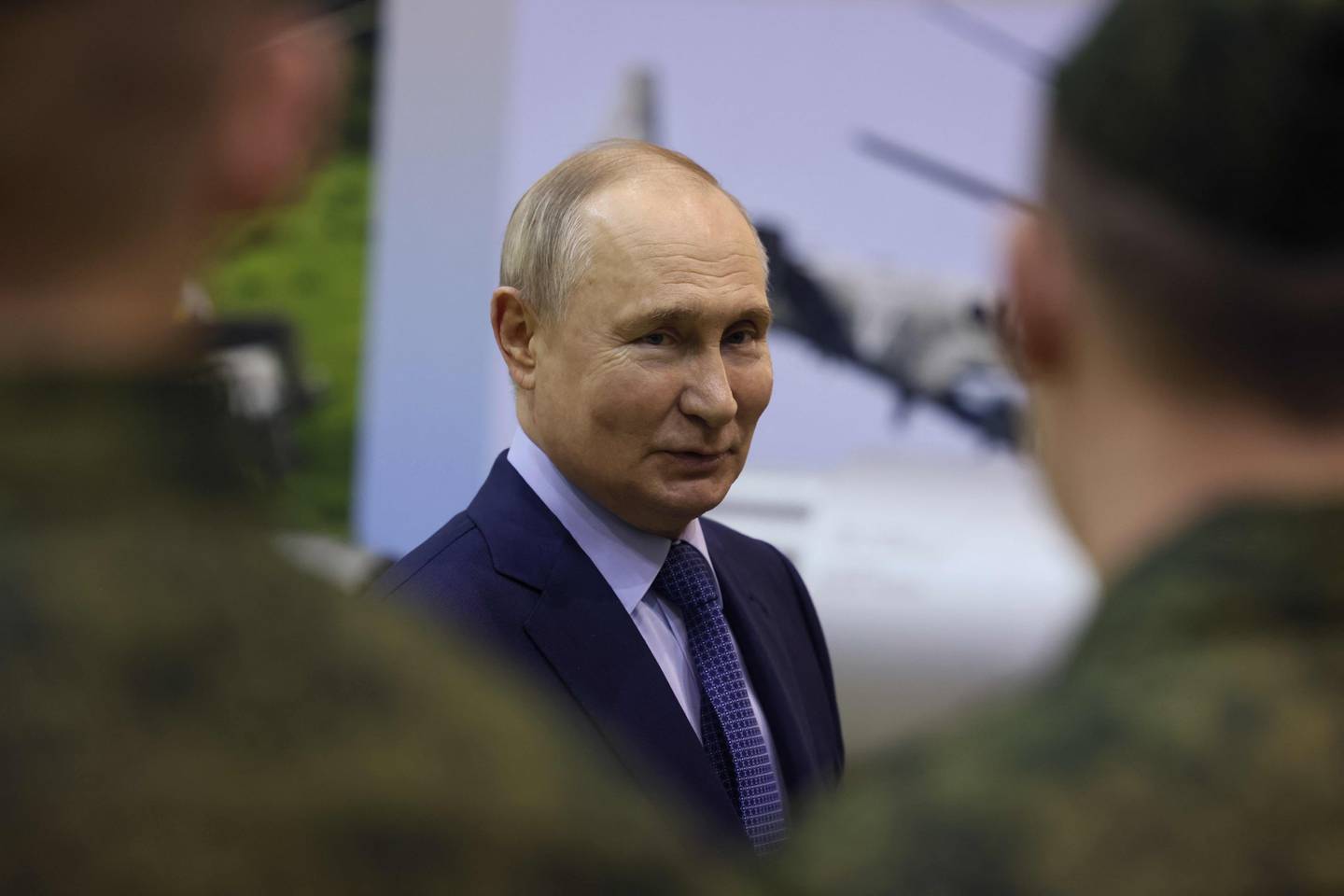 TOPSHOT - In this pool photograph distributed by the Russian state agency Sputnik, Russia's President Vladimir Putin visits the 344th Army Aviation Centre of aircrews combat training and transition in Torzhok in the Tver region on March 27, 2024. (Photo by Mikhail METZEL / POOL / AFP)