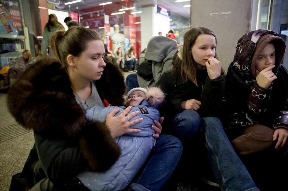 Familie fra Odesa på togstasjonen i Kharkiv.