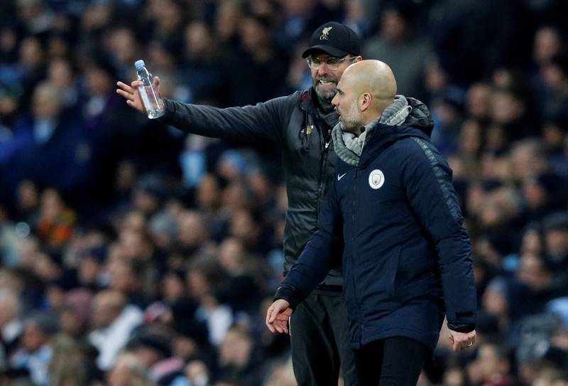 Soccer Football - Premier League - Manchester City v Liverpool - Etihad Stadium, Manchester, Britain - January 3, 2019  Manchester City manager Pep Guardiola and Liverpool manager Juergen Klopp talk to each other during the match   REUTERS/Phil Noble  EDITORIAL USE ONLY. No use with unauthorized audio, video, data, fixture lists, club/league logos or "live" services. Online in-match use limited to 75 images, no video emulation. No use in betting, games or single club/league/player publications.  Please contact your account representative for further details.