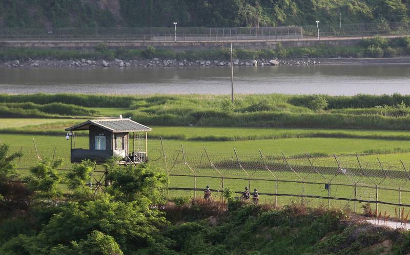 South Korean army soldiers patrol along the barbed-wire fence in Paju, South Korea, near the border with North Korea, Monday, June 15, 2020. South Korean President Moon Jae-in called on North Korea to stop raising animosities and return to talks, saying Monday the rivals must not reverse the peace deals that he and North Korean leader Kim Jong Un reached during 2018 summits. (AP Photo/Ahn Young-joon)