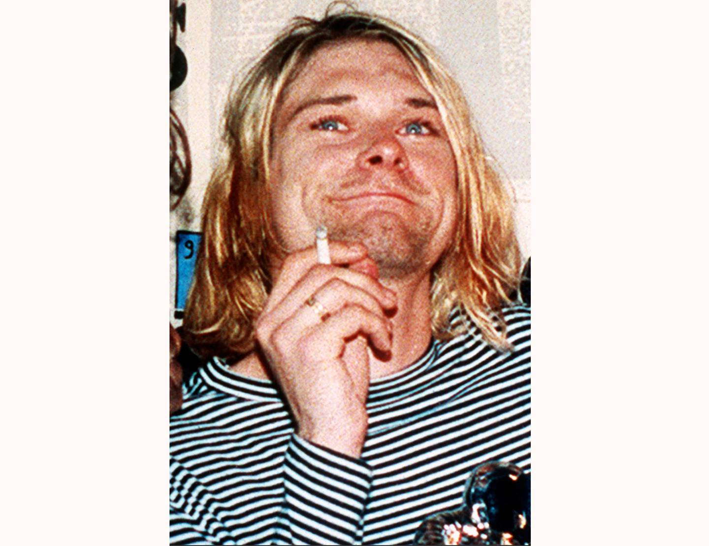 FILE - This 1993 file photo shows Kurt Cobain, the lead singer of the U.S. rock band Nirvana. Grunge became gold Saturday, June 20, 2020, as the guitar Cobain played on Nirvana's 1993 MTV Unplugged performance sold for an eye-popping $6 million at auction. (AP Photo/Mark J. Terrill, File)