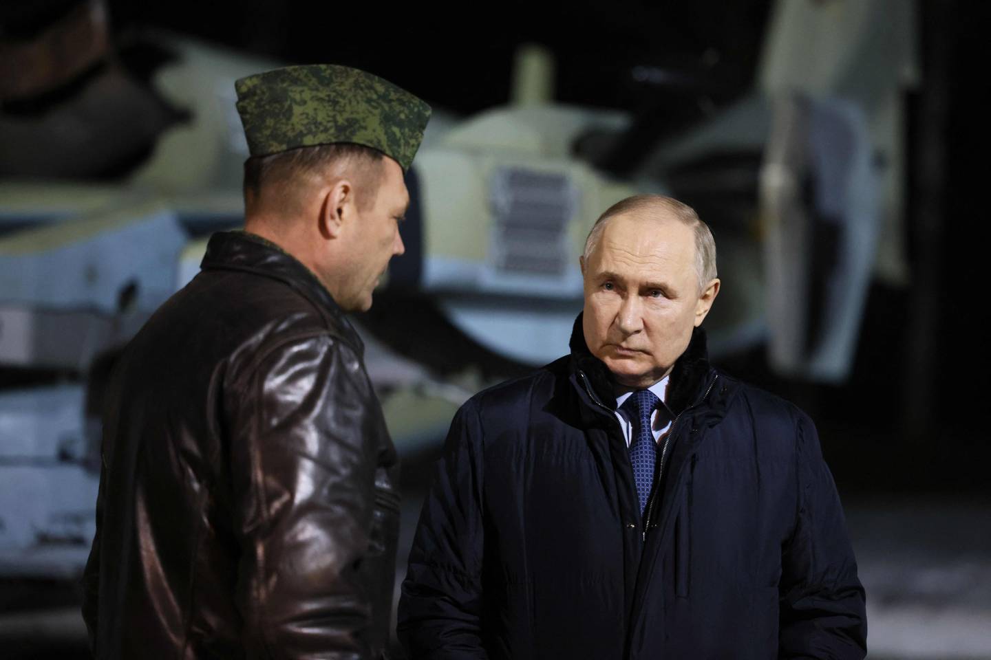 In this pool photograph distributed by the Russian state agency Sputnik, Russia's President Vladimir Putin visits the State Centre for Deployment and Retraining of Flight Personnel of the Russian Defence Ministry in Torzhok in the Tver region on March 27, 2024. (Photo by Mikhail METZEL / POOL / AFP)