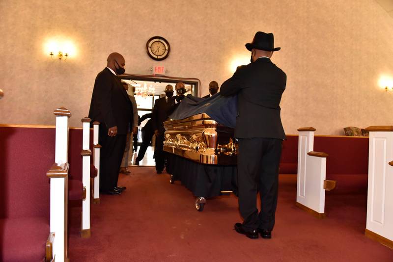 The casket of George Floyd arrives inside the church for a memorial service Saturday, June 6, 2020, in Raeford, N.C. Floyd died after being restrained by Minneapolis police officers on May 25. (Ed Clemente/The Fayetteville Observer via AP, Pool)