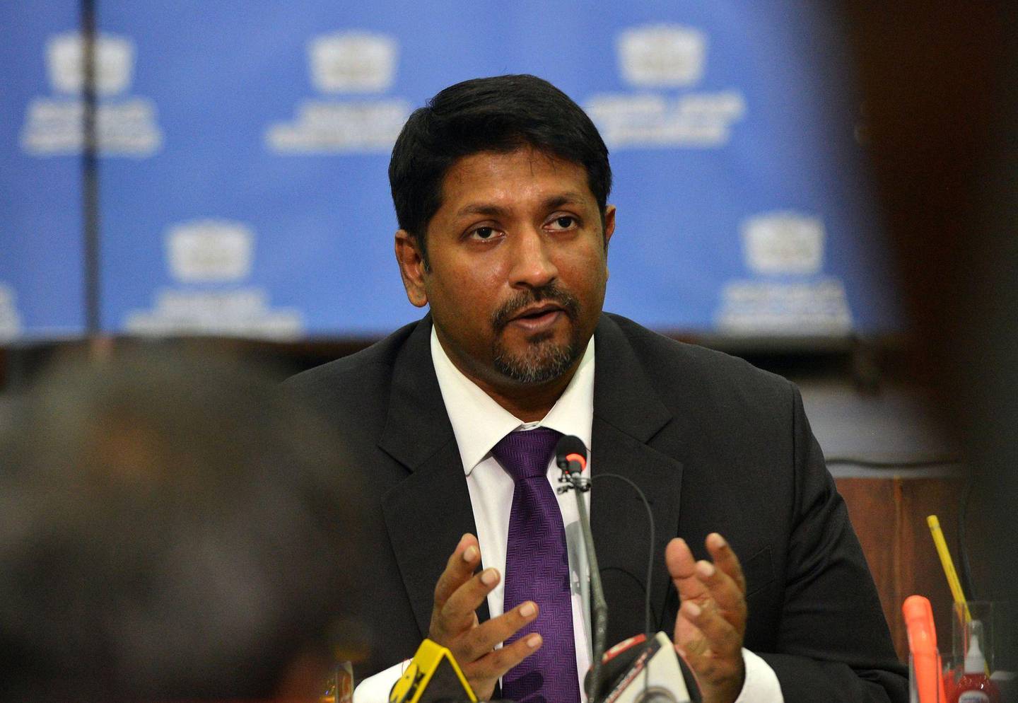 Sri Lanka's state minister of defence Ruwan Wijewardene (L) takes part in a press conference in Colombo on April 24, 2019. - A Sri Lankan security dragnet hunting those responsible for horrifying bombings that claimed more than 350 lives has scooped up a further 18 suspects, police said April 24, as pressure mounted on politicians to explain why no one acted on intelligence warnings. (Photo by ISHARA S. KODIKARA / AFP)