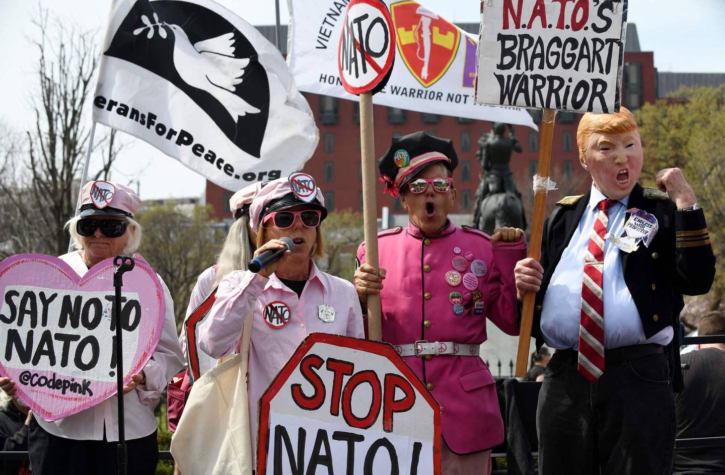 Activists rally in Lafayette Square to protest ahead of the 70th anniversary of the summit meeting of the North Atlantic Treaty Organization (NATO), March 30, 2019 in Washington, DC. - NATO foreign ministers will gather in Washington DC, on April 4, 2019. (Photo by Olivier Douliery / AFP)