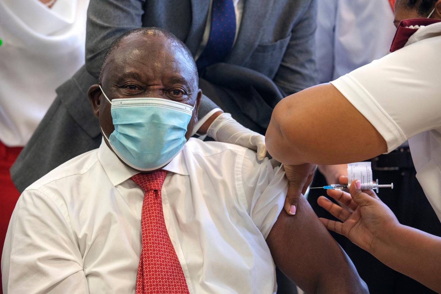 South African President Cyril Ramaphosa receives a Johnson and Johnson COVID-19 vaccine in Khayelitsha, Cape Town, South Africa, Wednesday, Feb. 17, 2021. Ramaphosa was among the first in his country to receive the vaccination to launch the inoculation drive in the country. (Gianluigi Guercia/Pool via AP)