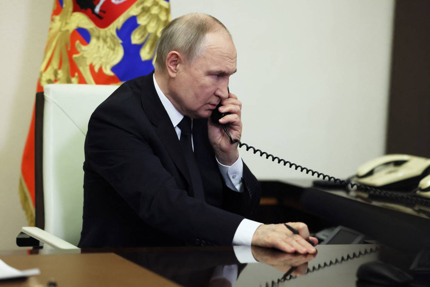 Russian President Vladimir Putin speaks on the phone as he delivers a video address to the nation following a shooting attack at the Crocus City Hall concert venue, at an unidentified location in Russia, March 23, 2024. Sputnik/Mikhail Metzel/Pool via REUTERS ATTENTION EDITORS - THIS IMAGE WAS PROVIDED BY A THIRD PARTY.