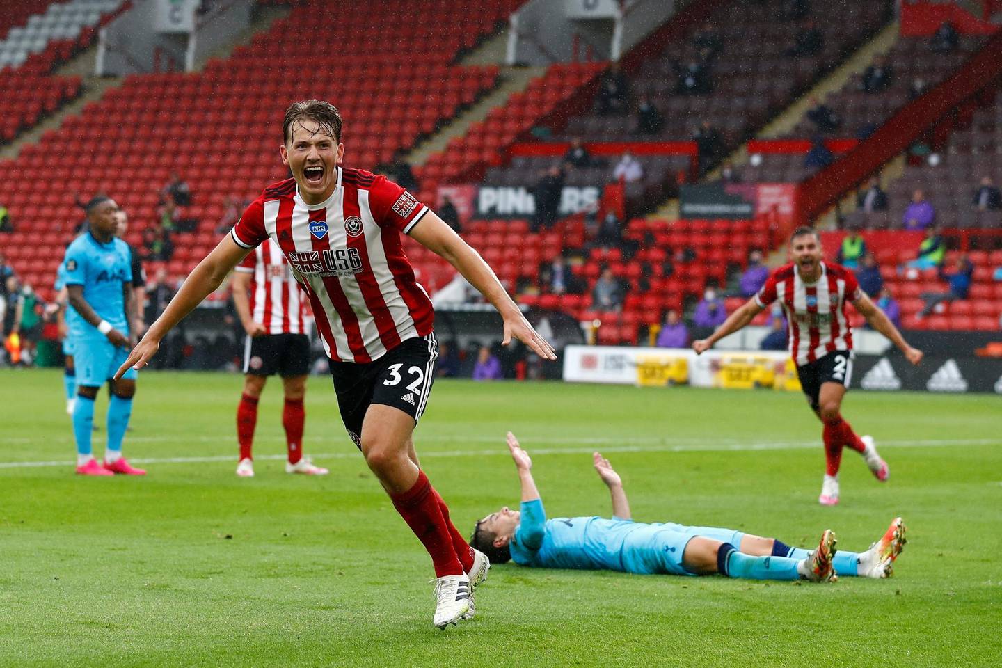 Sheffield United's Sander Berge celebrates after scoring the opening goal of his team during the English Premier League soccer match between Sheffield United and Tottenham Hotspur at Bramall Lane in Sheffield, Thursday, July 2, 2020. (Jason Cairnduff/Pool via AP)