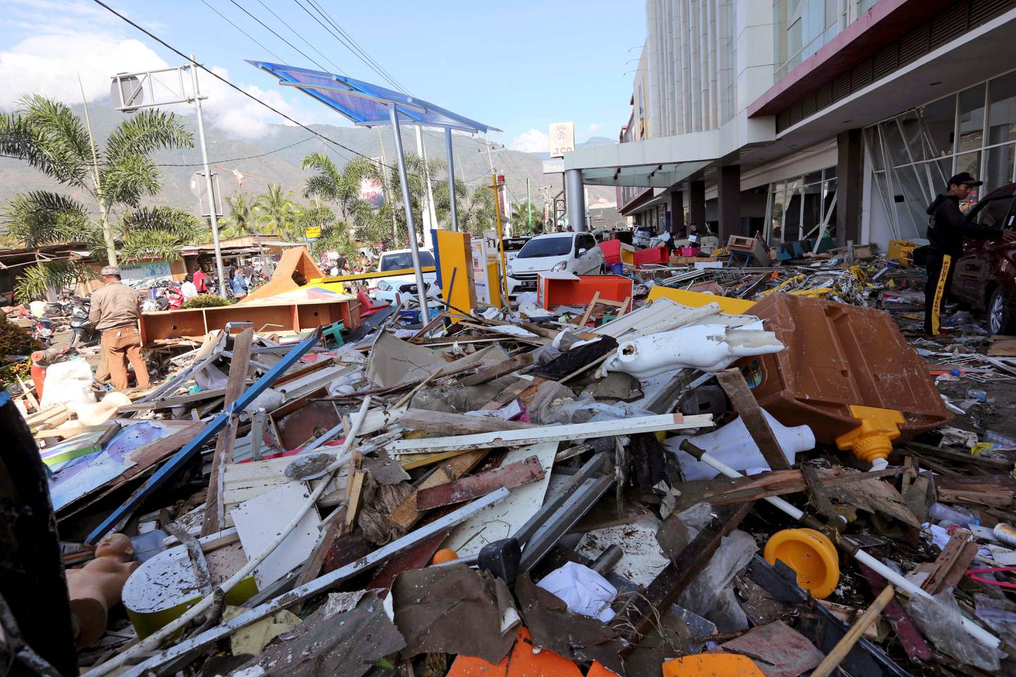 A pile of debris is seen at a shopping mall damaged following earthquakes and tsunami in Palu, Central Sulawesi, Indonesia, Sunday, Sept. 30, 2018. A tsunami swept away buildings and killed hundreds on the Indonesian island of Sulawesi.(AP Photo/Tatan Syuflana)