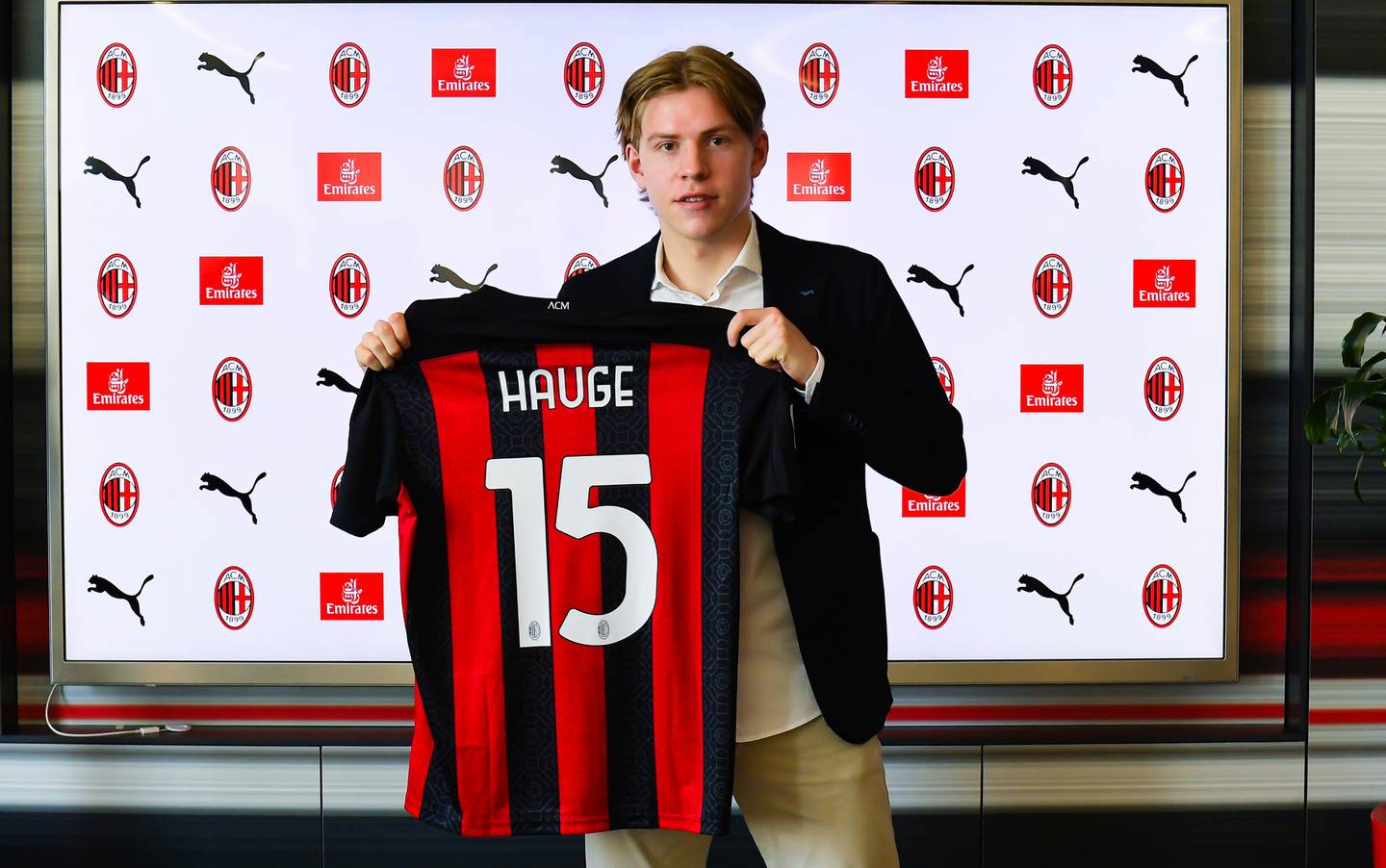 Norway's Jens Petter Hauge poses with his AC Milan's jersey during the official presentation at the Milan team headquarters, Italy, Thursday, Oct. 1, 2020. (Claudio Grassi/LaPresse via AP)