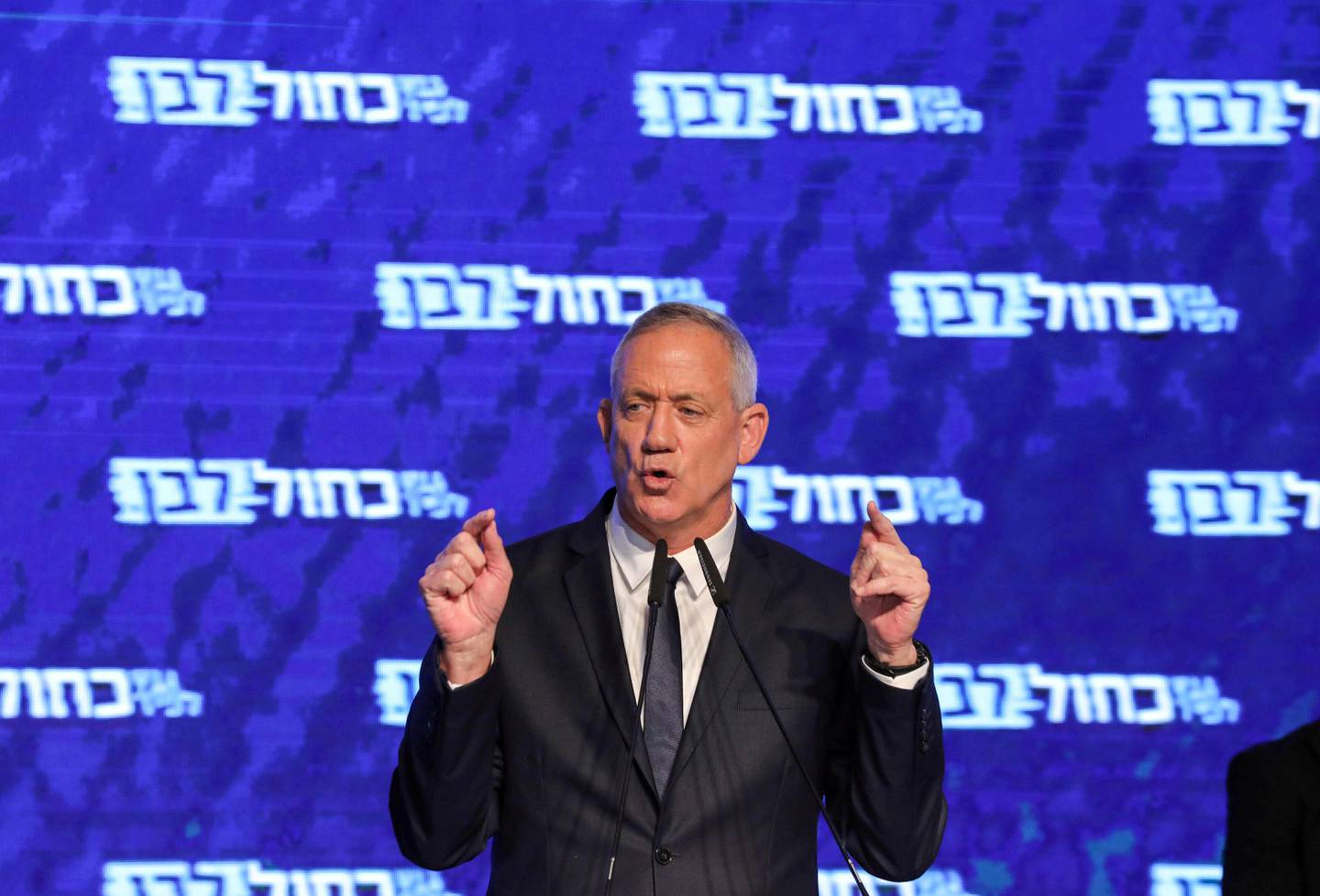Retired Israeli general Benny Gantz, one of the leaders of the Blue and White (Kahol Lavan) political alliance, speaks before supporters at the alliance headquarters in Tel Aviv on April 10, 2019. (Photo by GALI TIBBON / AFP)