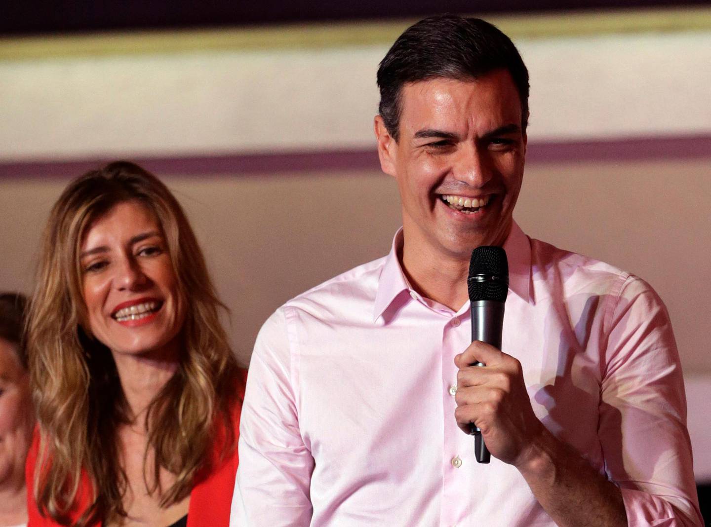 Spanish Prime Minister and Socialist Party candidate Pedro Sanchez speaks to supporters gathered at the party headquarters waiting for results of the general election in Madrid, Sunday, April 28, 2019. Spain's governing Socialists won the country's national election Sunday but will need the backing of smaller parties to stay in power, while a far-right party rode a groundswell of support to enter the lower house of parliament for the first time in four decades, provisional results showed. At left is his wife Maria Begona Gomez. (AP Photo/Andrea Comas)