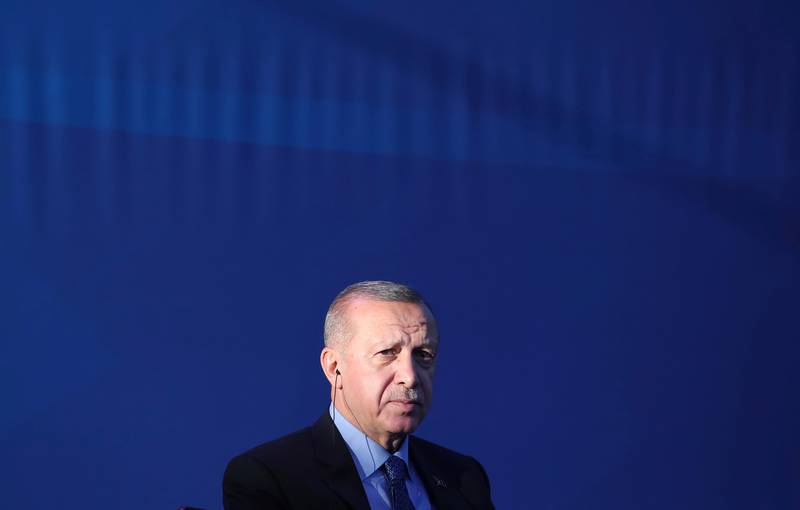 Turkey's President Recep Tayyip Erdogan attends a ceremony to inaugurate a Turkey-financed highway linking Belgrade with Bosnia's capital of Sarajevo in Sremska Raca, some 80 kilometers (49 miles) west of Belgrade, Serbia, during his two-day official visit, Tuesday, Oct. 8, 2019. The White House said Sunday that U.S. forces in northeast Syria will move aside and clear the way for an expected Turkish assault, essentially abandoning Kurdish fighters who fought alongside American forces in the years long battle to defeat Islamic State militants. Erdogan has threatened for months to launch the military operation across the border as he views the Kurdish forces as a threat to his country. (Presidential Press Service via AP, Pool)