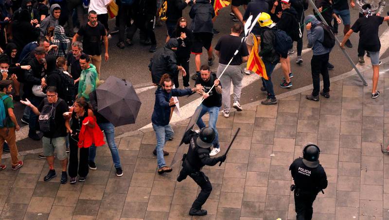 Protesters clash with police during a demonstration at Barcelona's airport, after a verdict in a trial over a banned independence referendum, Spain October 14, 2019. REUTERS/Jon Nazca
