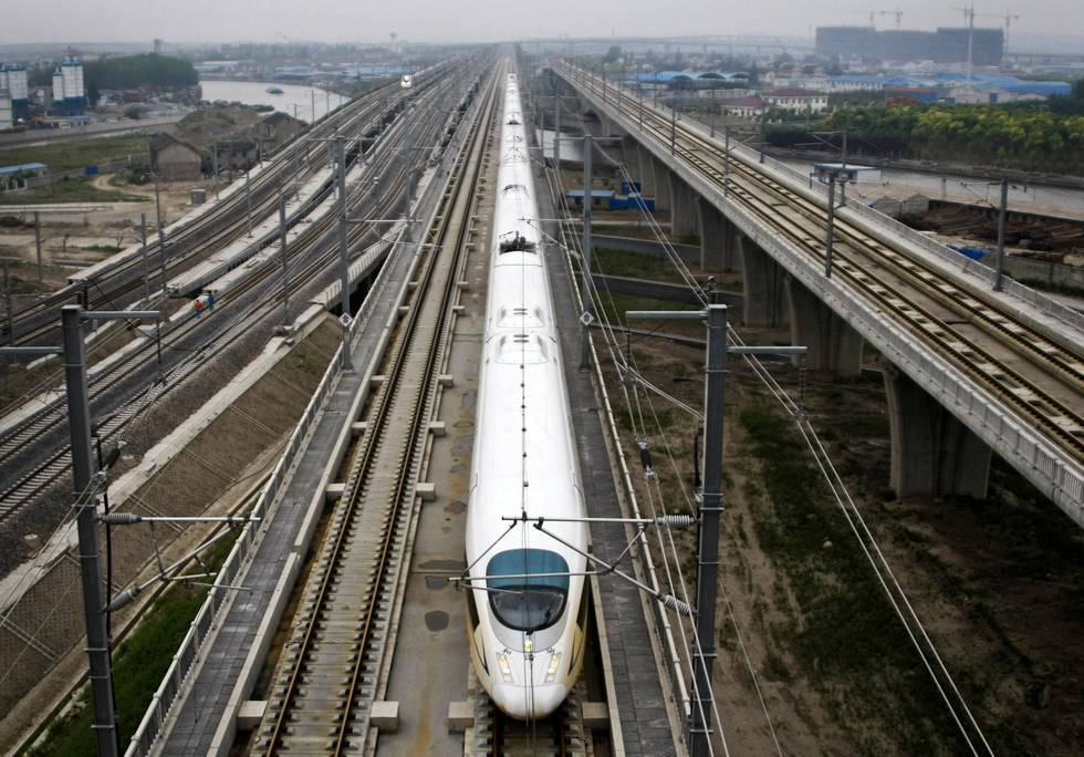 A CRH high speed train runs on the Beijing-Shanghai High-Speed Railway in Shanghai, China Wednesday, May 11, 2011. A long-anticipated high-speed railway between Beijing and Shanghai began trial operations Wednesday, as China persists with its lavish rail spending despite recent losses and scandals. (AP Photo) CHINA OUT