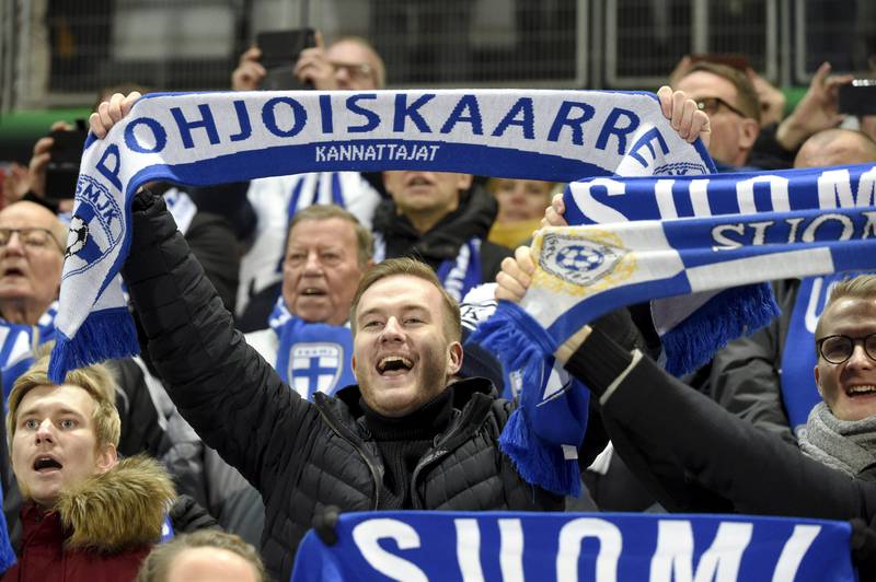 Soccer Football - Euro 2020 - Group J Qualification - Finland v Liechtenstein - Helsinki, Finland November 15, 2019. Team Finland fans celebrate the first goal. Lehtikuva/Markku Ulander via REUTERS    ATTENTION EDITORS - THIS IMAGE HAS BEEN SUPPLIED BY A THIRD PARTY. FINLAND OUT. NO COMMERCIAL OR EDITORIAL SALES IN FINLAND. NO THIRD PARTY SALES. NOT FOR USE BY REUTERS THIRD PARTY DISTRIBUTORS