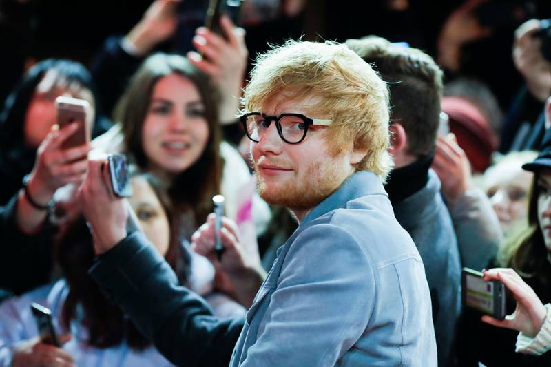 FILE - In this Friday, Feb. 23, 2018 file photo, singer-songwriter Ed Sheeran arrives for the screening of the film 'Songwriter' during the 68th edition of the International Film Festival Berlin, Berlinale, in Berlin, Germany. British singing sensation Ed Sheeran wants to build a private chapel on his property in eastern England, but he may be stopped by great crested newts. (AP Photo/Markus Schreiber, File)