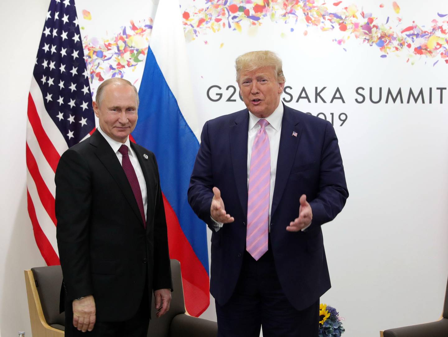 Russian President Vladimir Putin and US President Donald Trump hold a meeting on the sidelines of the G20 summit in Osaka on June 28, 2019. (Photo by Mikhail KLIMENTYEV / SPUTNIK / AFP)