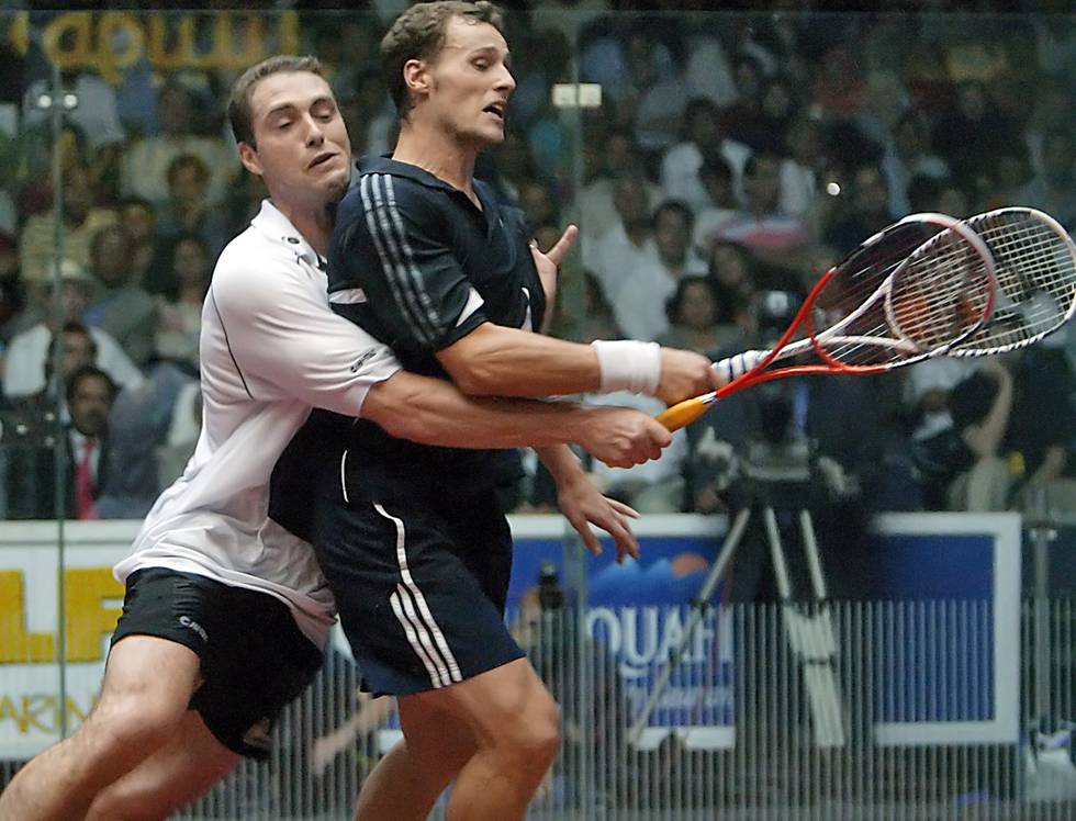 Australias David Palmer (t.v.) mot Frankrikes Gregory Gaultier i et tidligere squash-mesterskap.