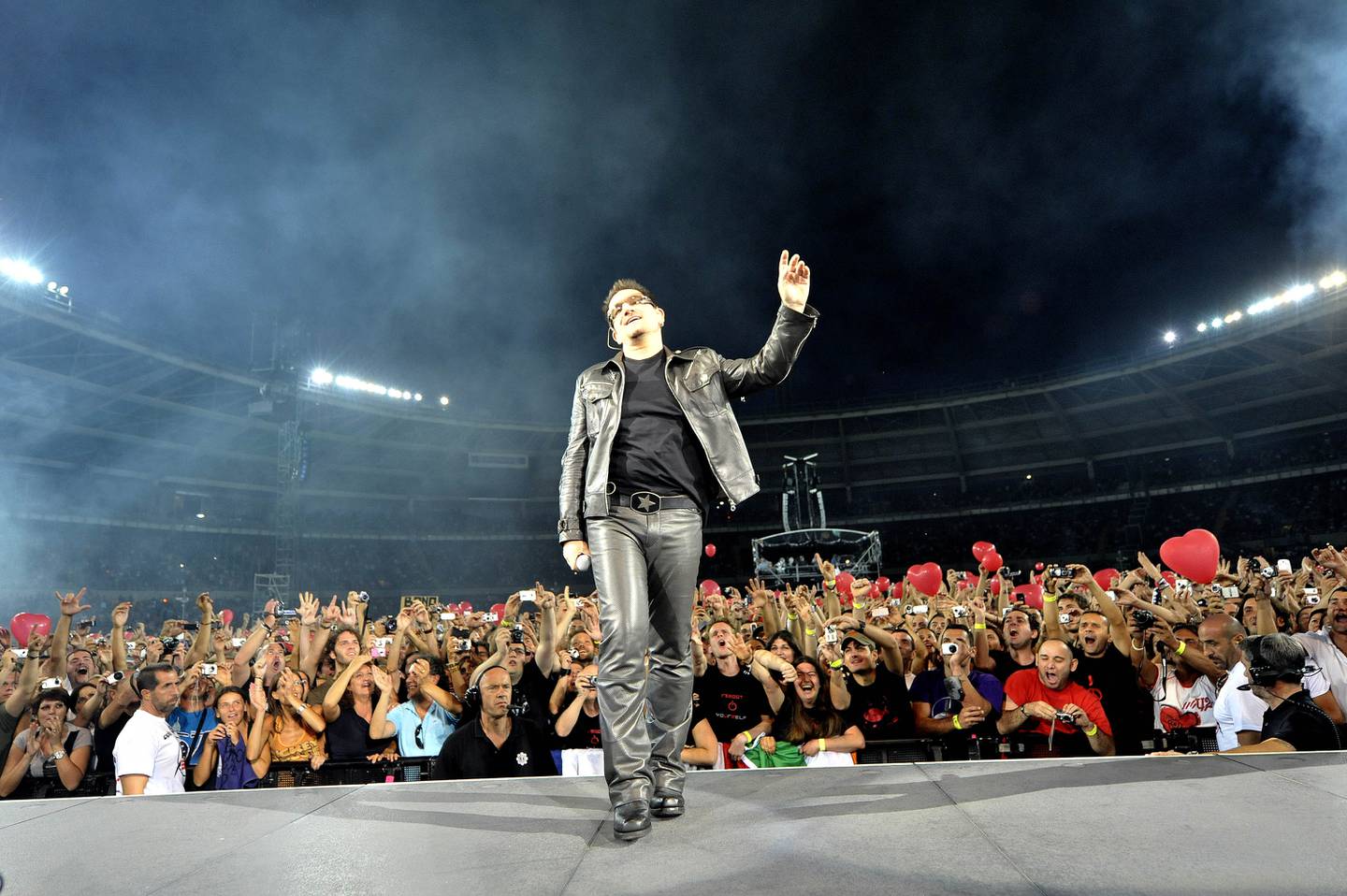 Singer Bono of Irish band U2 performs during their first concert of the new European tour after Bono underwent back surgery following an injury during training, in Turin, Italy, Friday, Aug. 6, 2010. After the European dates, the band will then head to the United States, Australia and New Zealand for a series of shows. (AP Photo/Massimo Pinca)