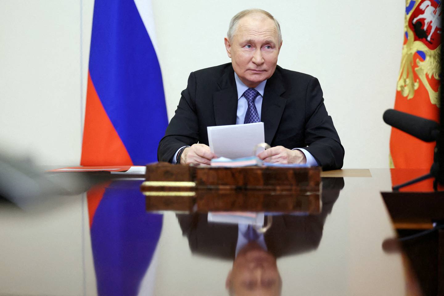 FILE PHOTO: Russian President Vladimir Putin chairs a meeting with members of the Security Council via video link at the Novo-Ogaryovo state residence outside Moscow, Russia February 13, 2024. Sputnik/Alexander Kazakov/Pool via REUTERS ATTENTION EDITORS - THIS IMAGE WAS PROVIDED BY A THIRD PARTY./File Photo
