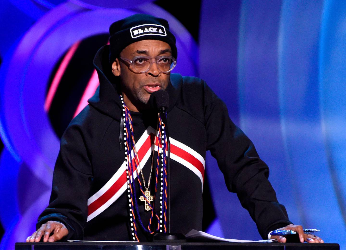 FILE - In this March 3, 2018, file photo, Spike Lee presents the award for best director at the 33rd Film Independent Spirit Awards in Santa Monica, Calif. Lee's "BlacKkKlansman" will open in theaters on the one-year anniversary of the violent protests in Charlottesville, Virginia, where white nationalists marched and a counterprotester was killed. Focus Features on Monday, April 9, 2018, announced that Lee's newly retitled drama will be released Aug. 10. (Photo by Chris Pizzello/Invision/AP, File)