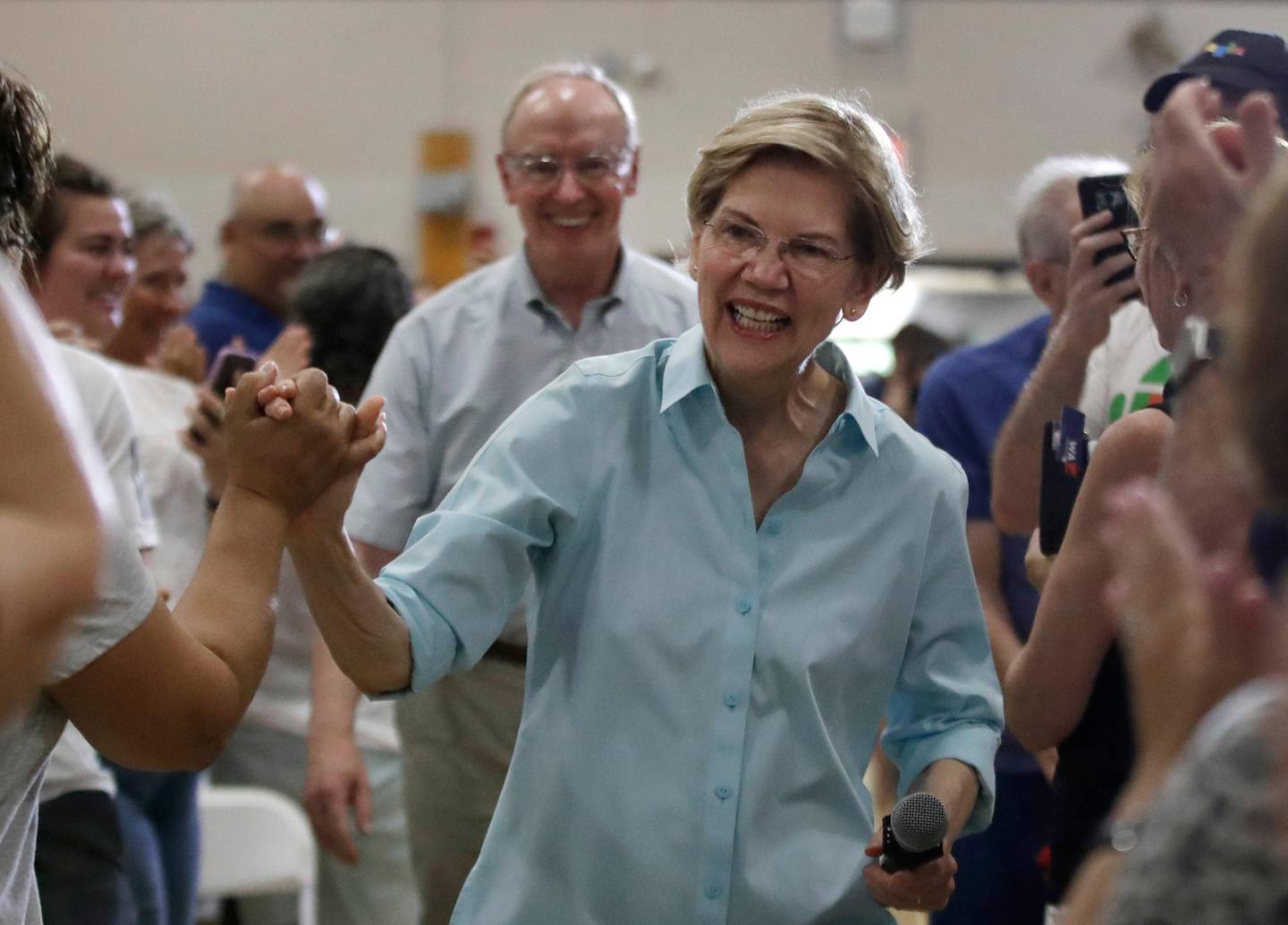 Democratic presidential candidate Sen. Elizabeth Warren, D-Mass., greets people as she arrives at a campaign event, Saturday, July 27, 2019, in Derry, N.H. (AP Photo/Elise Amendola)