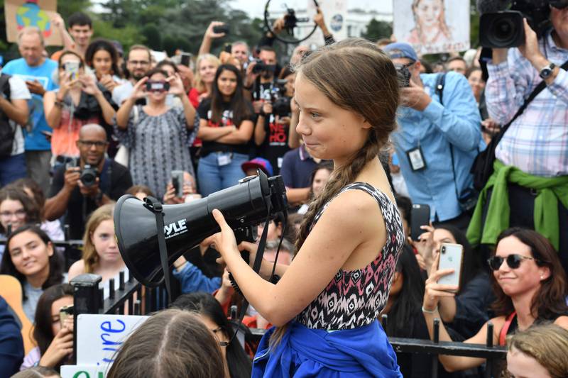 (FILES) In this file photo taken on September 13, 2019, Swedish climate activist Greta Thunberg speaks at a climate protest outside the White House in Washington, DC. - US President Donald Trump on December 12, 2019, slammed Time magazine's naming of  Thunberg as 2019 Person of the Year, saying the climate activist should "chill" and go see a movie. "So ridiculous. Greta must work on her Anger Management problem, then go to a good old fashioned movie with a friend! Chill Greta, Chill!" he tweeted. (Photo by Nicholas Kamm / AFP)