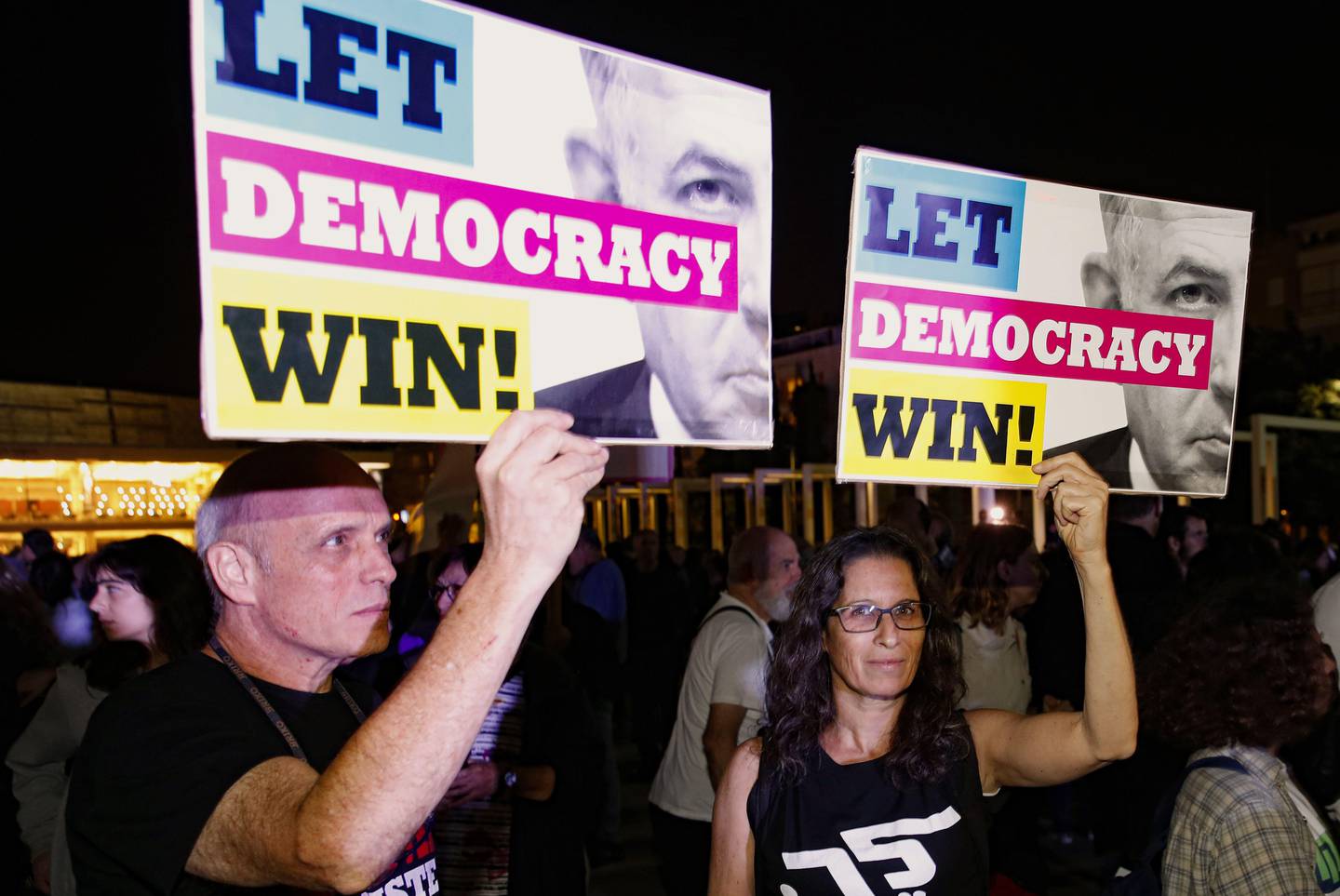 Israeli opposition supporters hold placards as they take part in a rally against Prime Minister Benjamin Netanyahu in the coastal city of Tel Aviv on November 23, 2019. - Netanyahu's indictment on corruption charges prompted speculation that the end of his decade-long tenure was nigh, though several key allies expressed support for the beleaguered Israeli premier.
The Israeli Parliament now has less than three weeks to find a candidate who can gain the support of more than half of the 120 lawmakers, or a deeply unpopular third election will be called. (Photo by JACK GUEZ / AFP)
