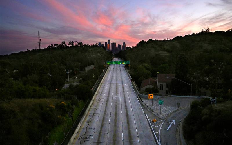 Empty lanes of the 110 Arroyo Seco Parkway lead to downtown Los Angeles on Sunday, April 26, 2020, during the coronavirus outbreak. (AP Photo/Mark J. Terrill, File)