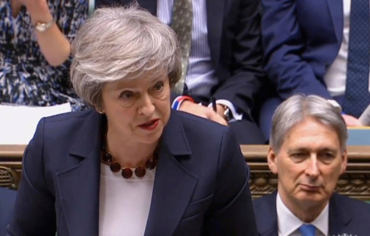In this grab taken from video, Britain's Prime Minister Theresa May speaks during Prime Minister's Questions in the House of Commons, London, Wednesday, Jan. 9, 2019.  The British government brought its little-loved Brexit deal back to Parliament on Wednesday, a month after postponing a vote on the agreement to stave off near-certain defeat. (House of Commons/PA via AP)