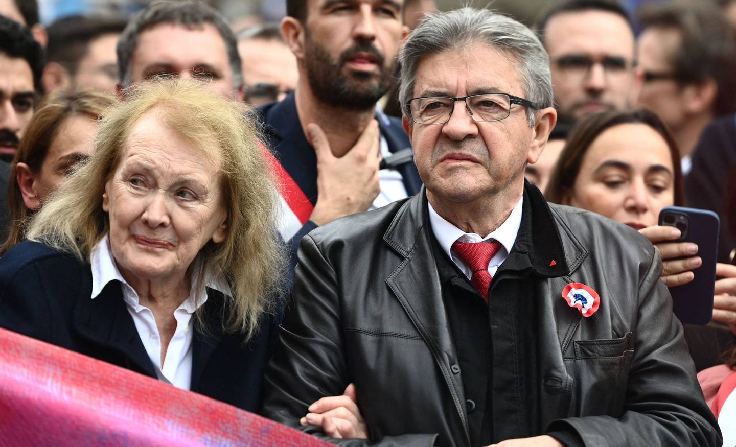 2022 Nobel Literature Prize laureate French novelist Annie Ernaux (L) and Founder of La France Insoumise (LFI) and member of left-wing coalition NUPES (New People's Ecologic and Social Union) Jean-Luc Melenchon attend a rally against soaring living costs and climate inaction called by French left-wing coalition NUPES (New People's Ecologic and Social Union) in Paris on October 16, 2022. (Photo by Christophe ARCHAMBAULT / AFP)