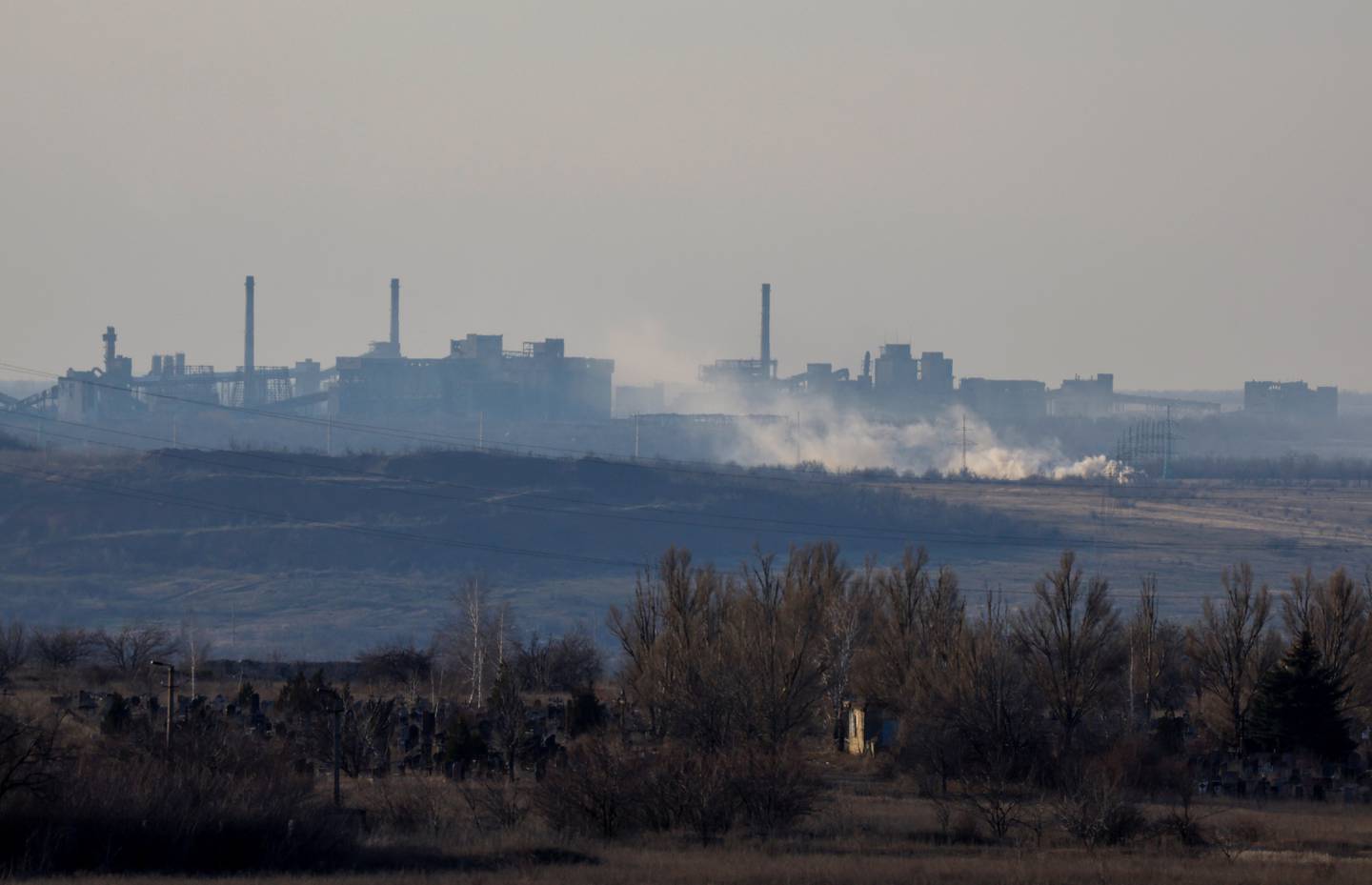 Smoke rises near the Avdiivka Coke and Chemical Plant in the town of Avdiivka in the course of Russia-Ukraine conflict, as seen from Yasynuvata (Yasinovataya) in the Donetsk region, Russian-controlled Ukraine, February 15, 2024. REUTERS/Alexander Ermochenko