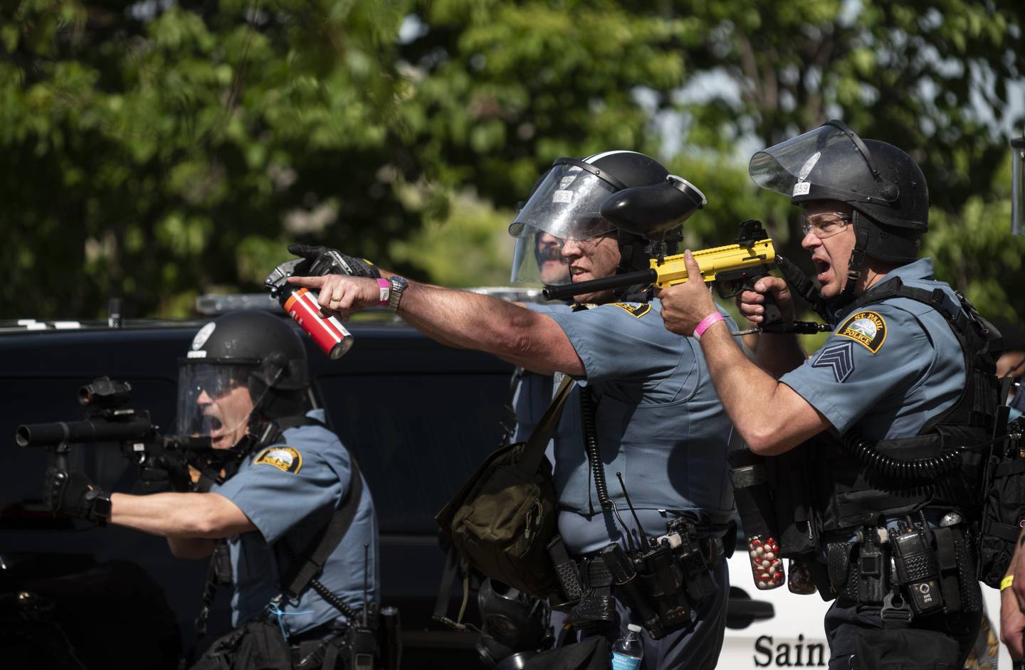 ST. PAUL, MN - MAY 28: Police aim their weapons at protesters in the parking lot of a Target store on May 28, 2020 in St. Paul, Minnesota. Police and protesters continued to clash for a third night after George Floyd was killed in police custody on Monday.   Stephen Maturen/Getty Images/AFP
== FOR NEWSPAPERS, INTERNET, TELCOS & TELEVISION USE ONLY ==
