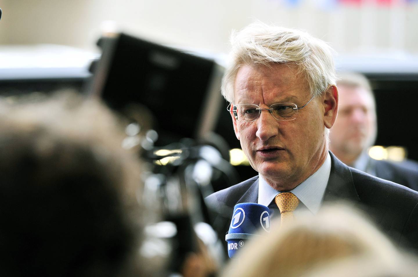 Swedish Foreign Affairs minister Carl Bildt talks to the press prior a Foreign Affairs Council on April 14,2014 at the EU Headquarters at the Kirchberg Conference Centre in Luxembourg.