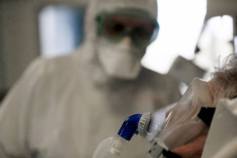 A patient is being treated in the Intensive Care Unit of the San Filippo Neri hospital in Rome, Tuesday, Oct. 27, 2020. Italy on Tuesday registered nearly 22,000 confirmed COVID-19 infections since the previous day, its highest one-day total so far in the pandemic. The day-to-day increase in confirmed deaths also jumped, to 221, according to Health Ministry figures. (Cecilia Fabiano/LaPresse via AP)