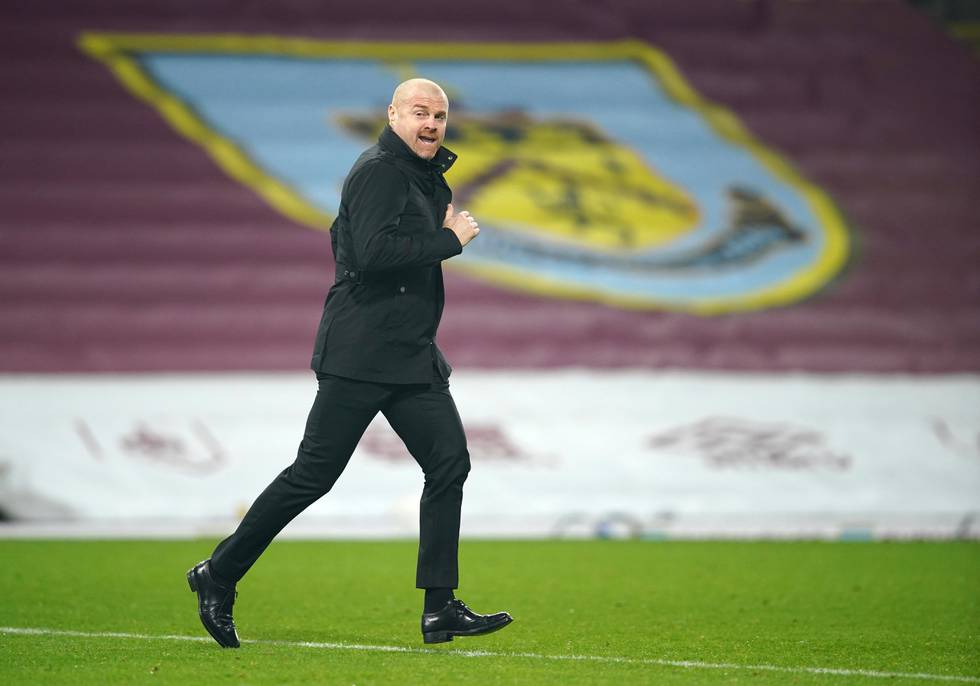 Burnley manager Sean Dyche runs to the touchline before the second half during the English Premier League soccer match between Burnley and Sheffield United at the Turf Moor stadium in Burnley, England, Tuesday, Dec. 29, 2020. (Dave Thompson/Pool via AP)