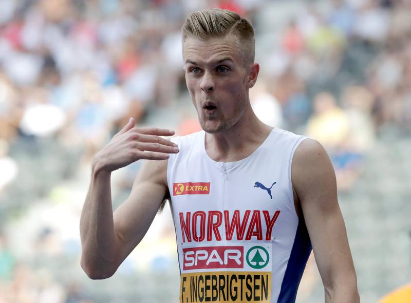 Norway's Filip Ingebrigtsen reacts after a men's 1.500 meter heat race at the European Athletics Championships in Berlin, Germany, Wednesday, Aug. 8, 2018. (AP Photo/Michael Sohn)