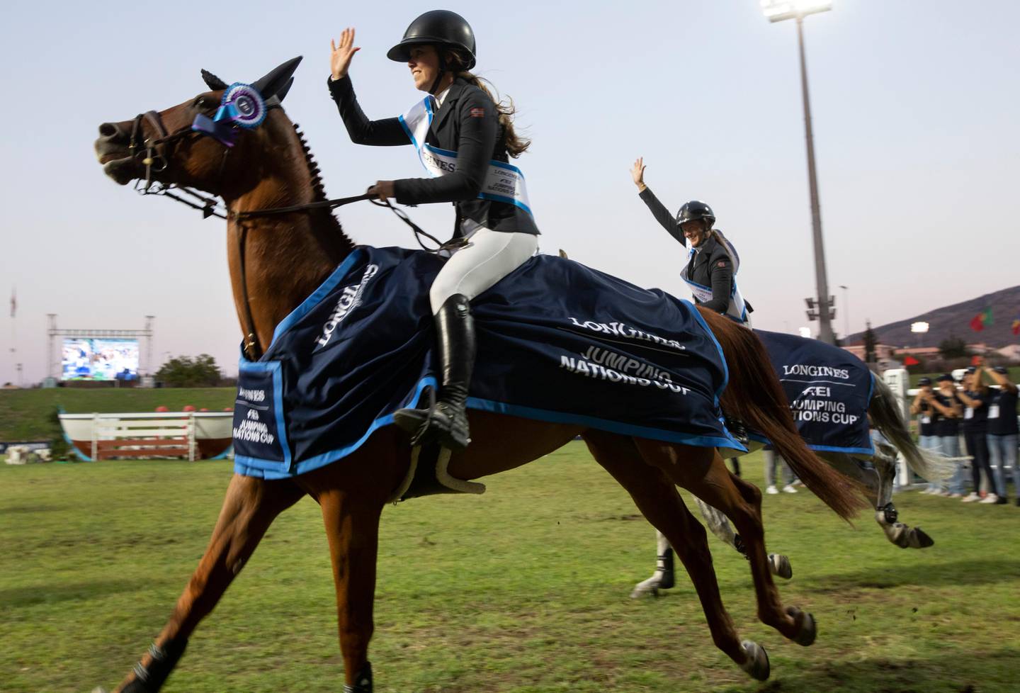 Victoria Gulliksen of Norway rides Papa Roach (L) next to Hege C Tidemandsen of Norway riding Carvis as the Norwegian equestrian team makes a victory lap after winning the Longines FEI Jumping Nations Cup of Greece in the Markopoulo Olympic Stadium Equestrian Center in Markopoulo, Greece, 28 July 2019. Norway won the event and Portugal came in second.
