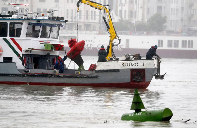 A rescue boat searches for survivors on the Danube River in Budapest, Hungary, Thursday, May 30, 2019. A massive search was underway on the Danube River in downtown Budapest for over a dozen people missing after a sightseeing boat with 33 South Korean tourists sank after colliding with another vessel during an evening downpour. (AP Photo/Laszlo Balogh)