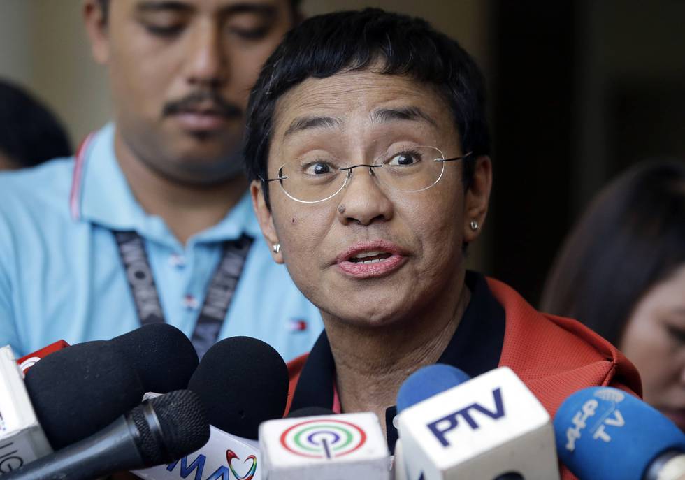 FILE - In this March 29, 2019, file photo, Rappler CEO and Executive Editor Maria Ressa talks to reporters after posting bail at the Pasig Regional Trial Court, metropolitan Manila, Philippines. Governments around the world are taking advantage of the coronavirus pandemic to justify crackdowns on press freedom. In June 2020, Ressa was convicted of cyber libel" in the Philippines. (AP Photo/Aaron Favila, File)