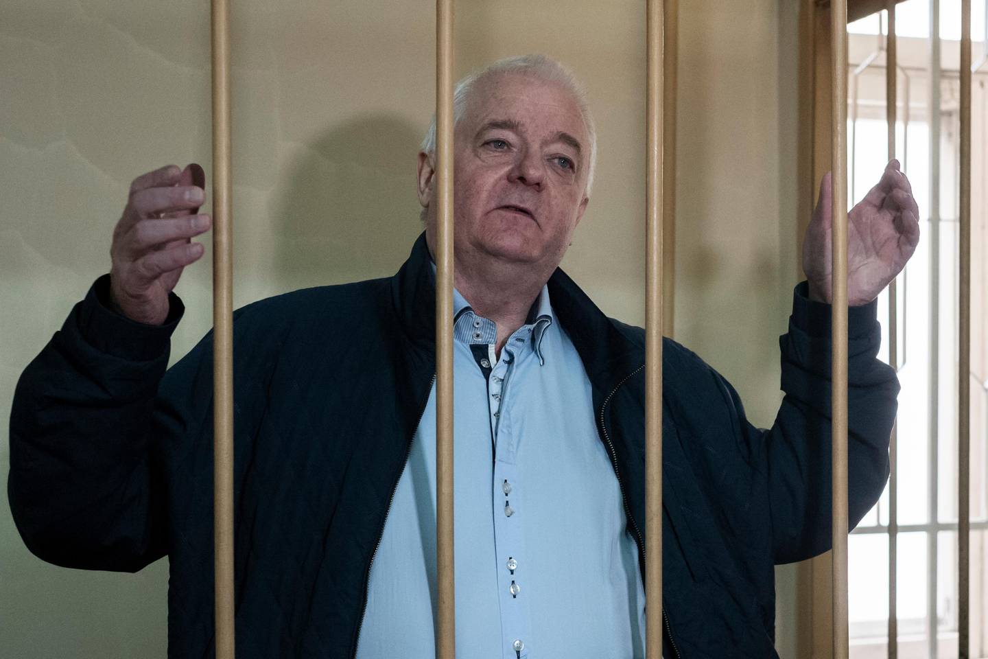 Norwegian national Frode Berg, who is accused of spying on Russia, stands in a cage in Lefortovo district court in Moscow, Russia, Monday, Oct. 1, 2018. Berg has been in custody since his arrest in December 2017 in Moscow. His lawyer believes the best opportunity now is prisoner exchange. (AP Photo/Alexander Zemlianichenko)