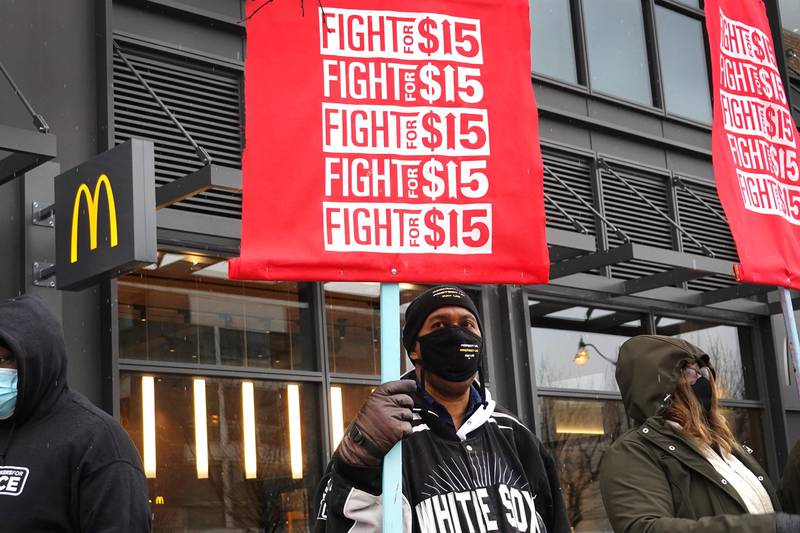 CHICAGO, ILLINOIS - JANUARY 15: Demonstrators participate in a protest outside of McDonald's corporate headquarters on January 15, 2021 in Chicago, Illinois. The protest was part of a nationwide effort calling for minimum wage to be raised to $15-per-hour.   Scott Olson/Getty Images/AFP
== FOR NEWSPAPERS, INTERNET, TELCOS & TELEVISION USE ONLY ==