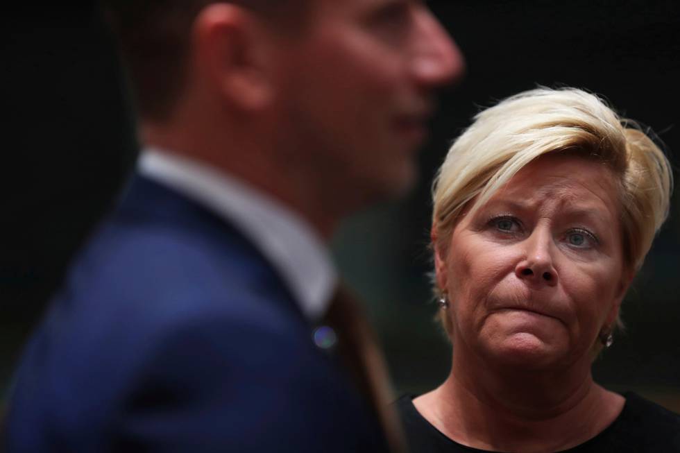 Norway Finance Minister Siv Jensen looks at Danish Finance Minister Kristian Jensen during an European Finance Ministers meeting at the European Council headquarters in Brussels, Tuesday, Nov. 6, 2018. (AP Photo/Francisco Seco)
